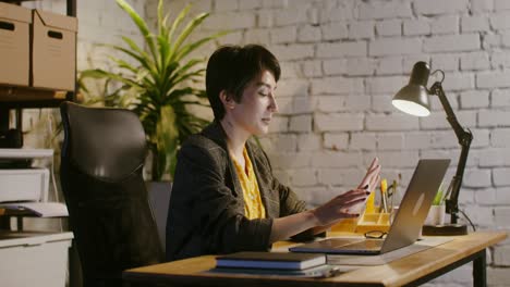 woman working on laptop in a modern office