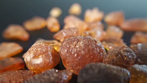 natural baltic amber stones on a black background-6