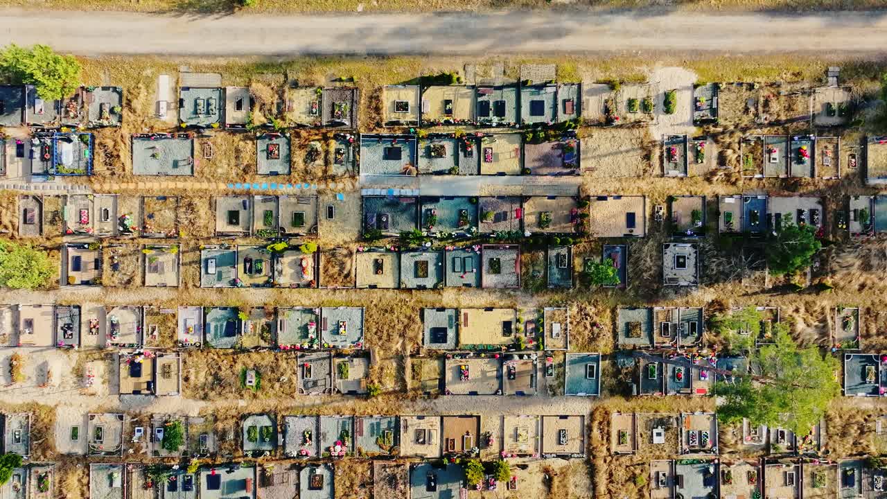 Aerial forward flight above cemetery in spring shows tidy patterns, fresh growth