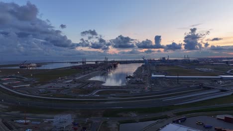 Dramatic-cloudy-sky-over-the-port-terminals-at-Maasvlakte,-Netherlands