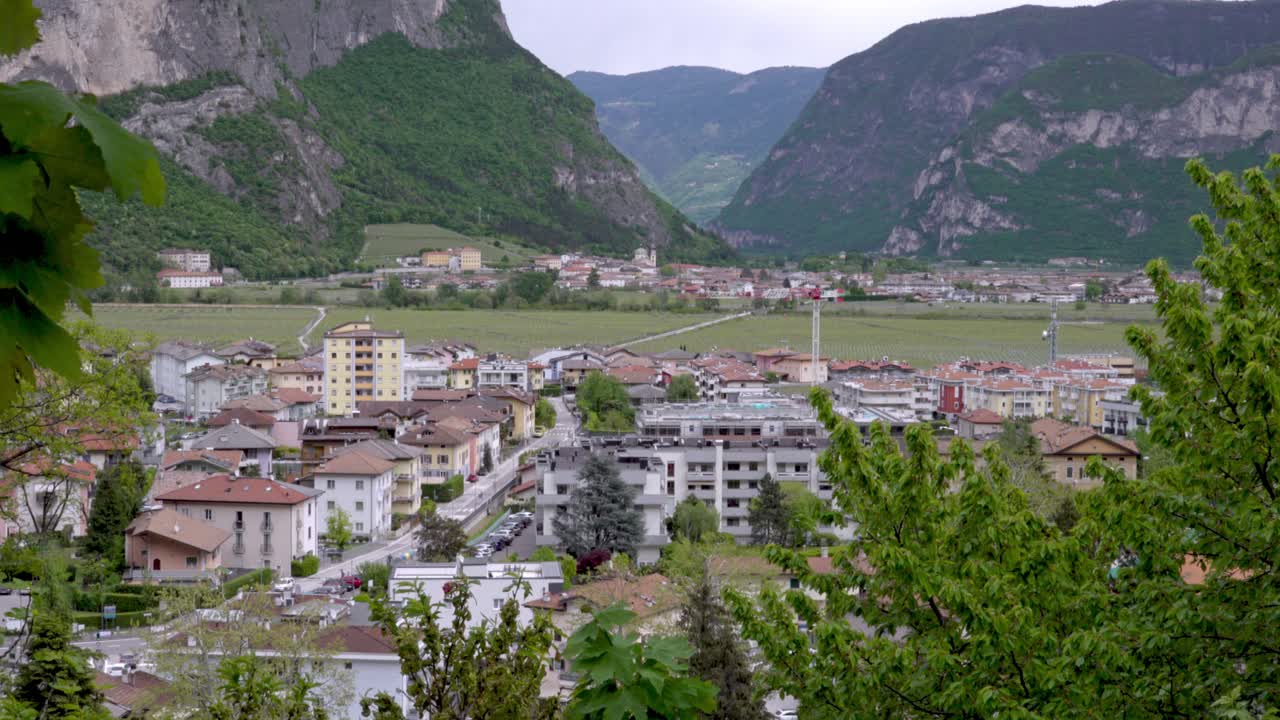 Scenic view of Mezzolombardo in the foreground and Mezzocorona in the background surrounded by mountains. Both towns are located in Trentino, Italy