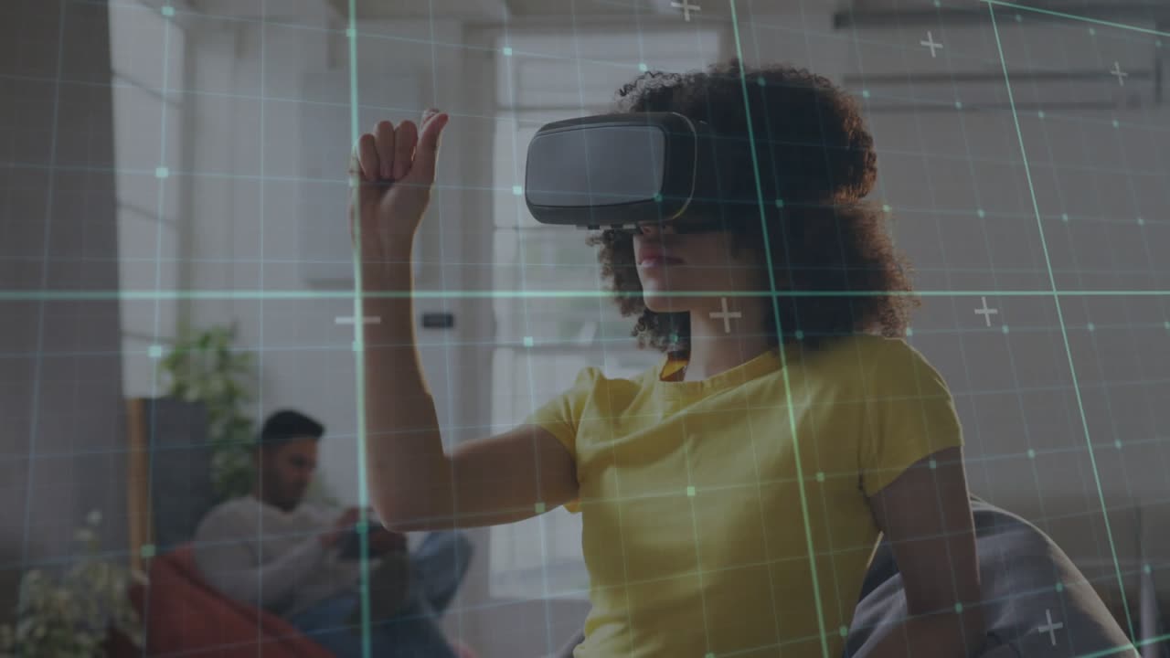 Woman wearing VR headset raising right finger and dragging virtual grid during technology demo