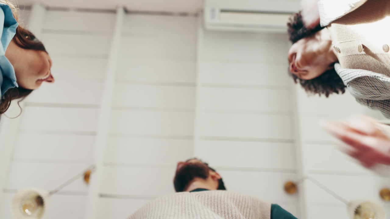 Diverse Team Creating a Star with Hands