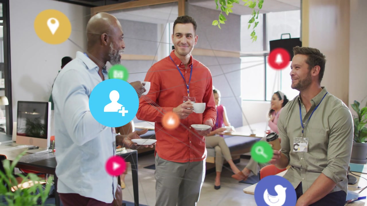 Three men chatting in office lounge, chat sparking animated app icons growing around faces and cups