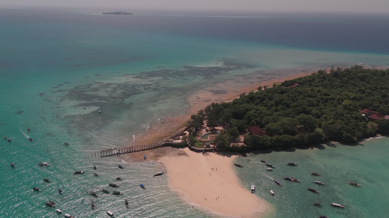 Stunning aerial shot of Changuu Island in Zanzibar, showcasing its beaches and boats
