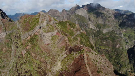 bird's eye view over the mirador del pico arieiro on madeira wide aerial drone shot