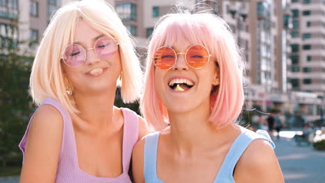 two friends in sunglasses and wigs