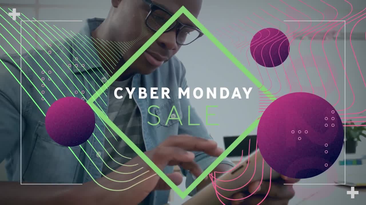 Video of cyber monday sale text and graphics while african american young man using tablet pc