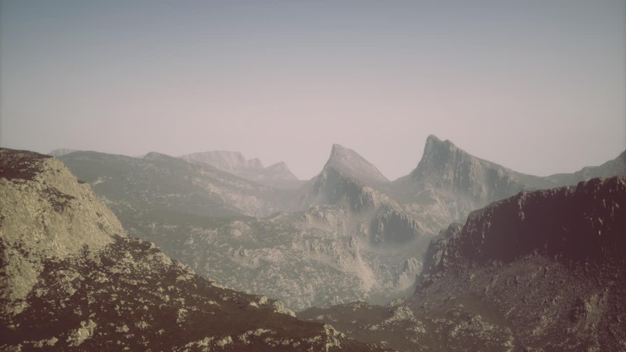 Scenic view of rugged mountain landscape under soft afternoon light