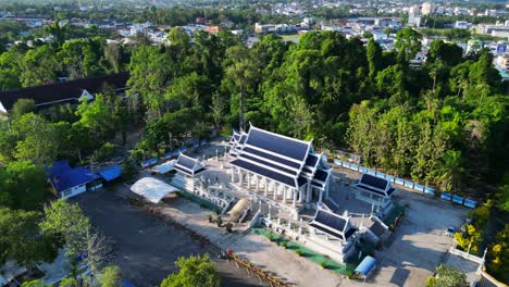 serene traditional thai temple complex, tropical landscape