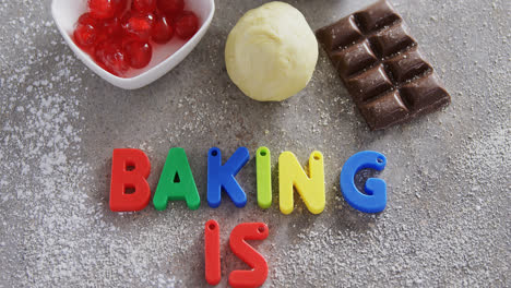 various baking ingredients and alphabet forming baking is fun 4k