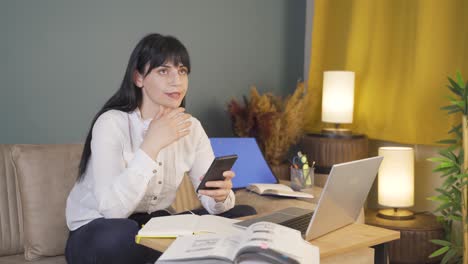 at home at night, angry woman is irritable and capricious to phone message.