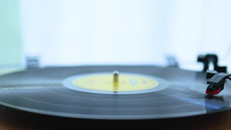 vinyl player spinning disk and playing music