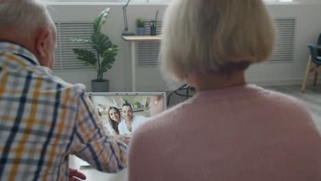 grandparents enjoying a video call with their family