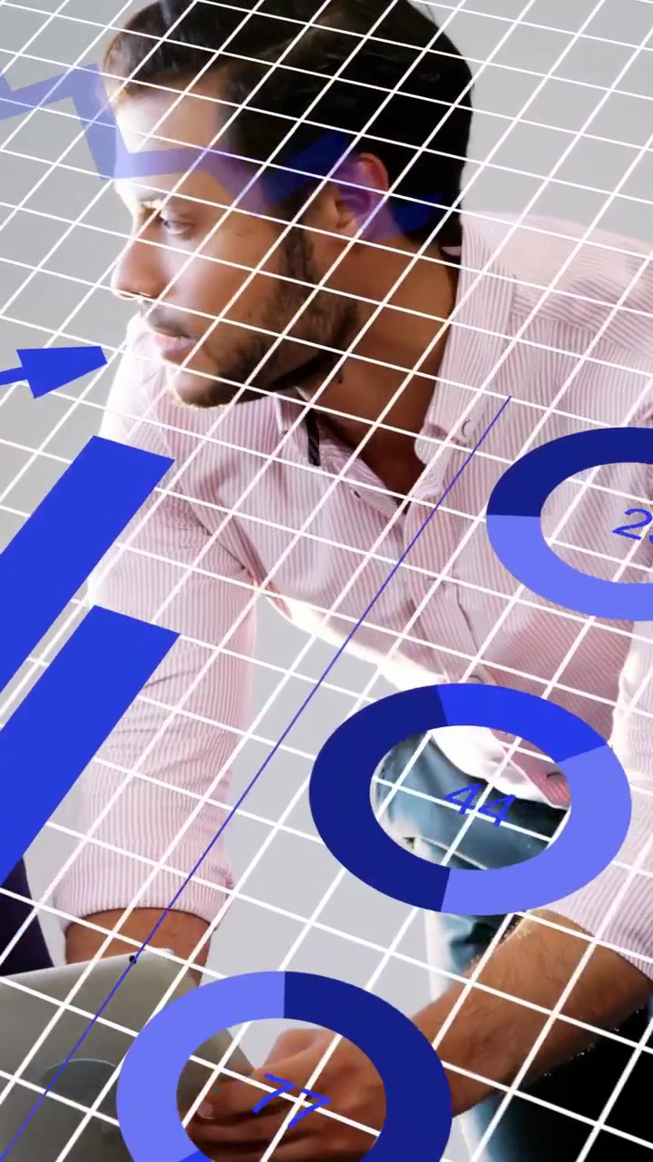 Vertical video: Man leaning over laptop using keys, analyzing business data causing animated charts