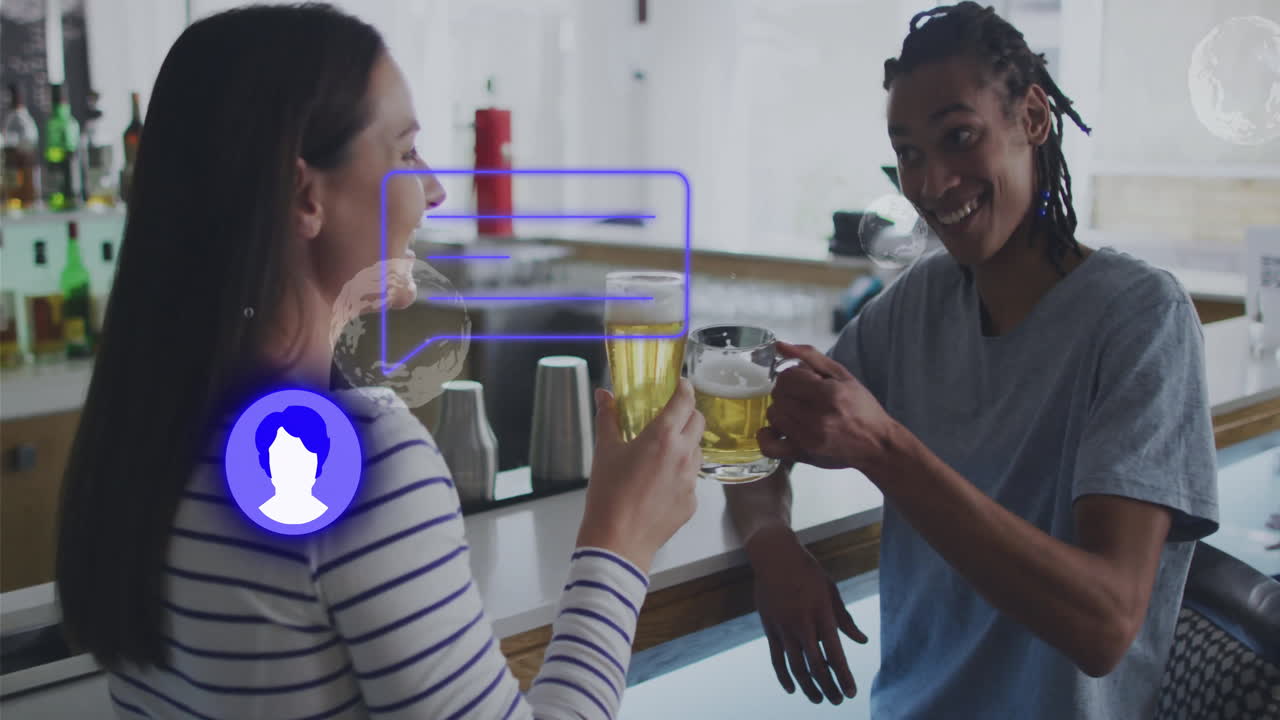 Two people clinking beer glasses at bar with digital profile animation overlay