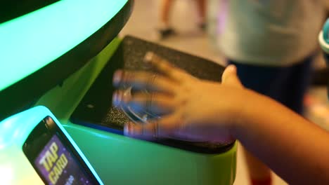 child playing an arcade game