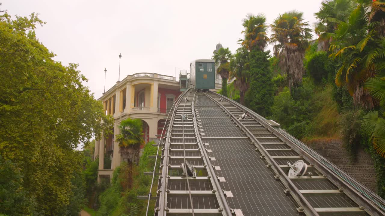 Historic funicular railway in Pau, France, lush greenery, serene setting
