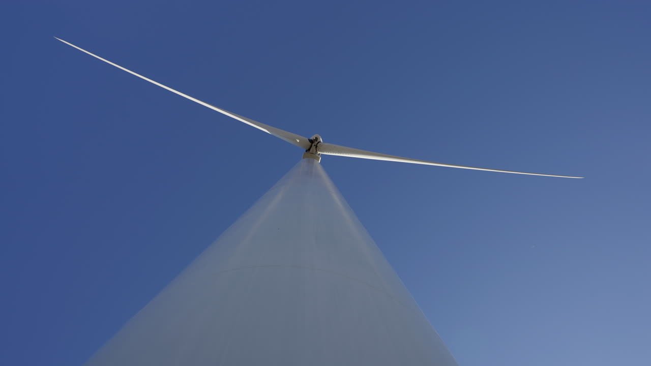 Low Angle Shot Of A Windmill Against Blue Sky