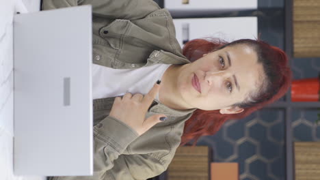 vertical video of business woman talking facetime through camera.