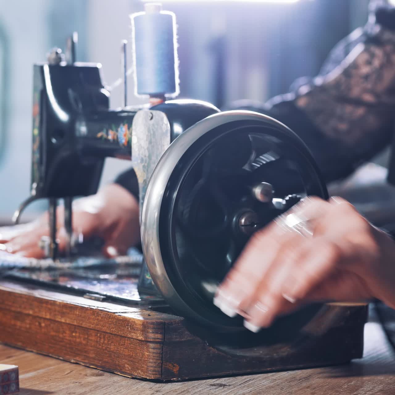 Seamstress with old sewing machine