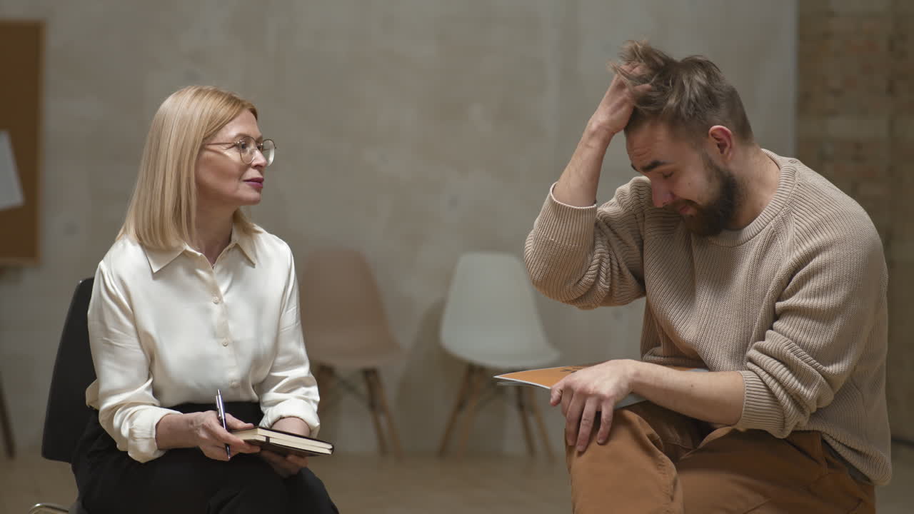 Female Psychologist and Depressed Man Talking