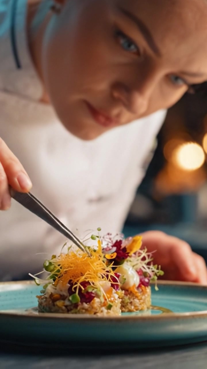 A Culinary Artist Delicately Assembles an Exquisite Plate of Gourmet Cuisine, Showcasing Precision and Creativity in Gourmet Food Presentation Techniques