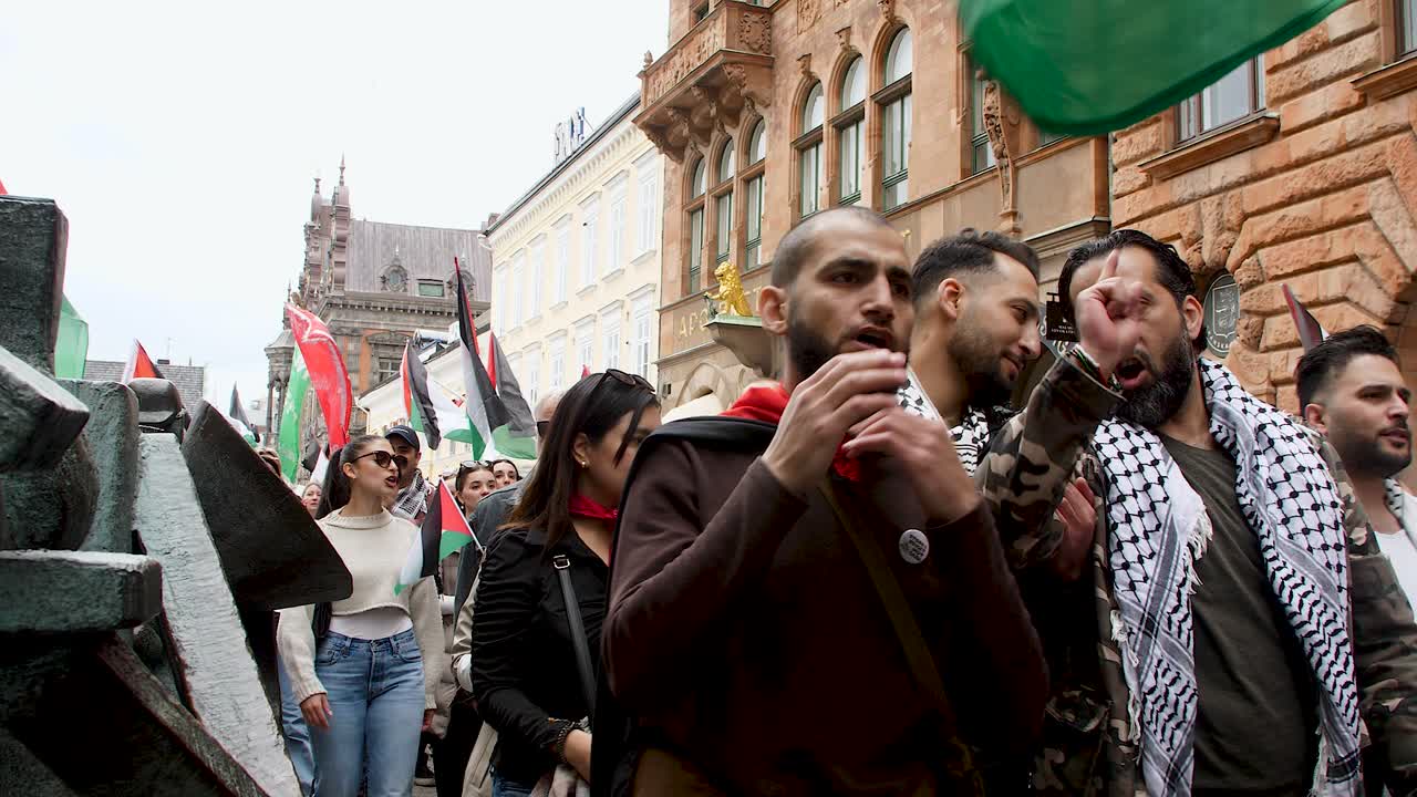 Pro Palestine protesters march against Israel’s Eurovision participation in Malmö (Sweden), calling for a ceasefire on the war in Gaza, Eurovision song contest 2024, medium handheld shot