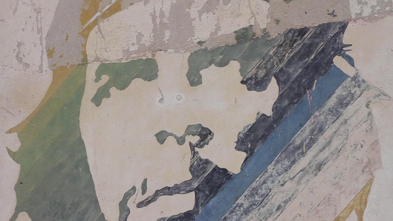 Close up of a faded mural portrait