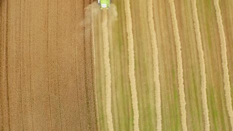 Drone-footage-of-golden-fields-and-combine-harvester