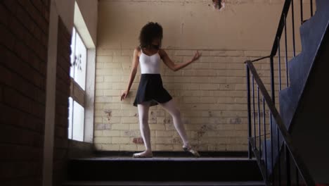 female dancer in an empty warehouse