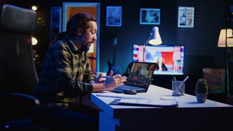 man working from home participating in corporate remote videoconference call