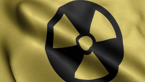 closeup 4k waving flag of the nuclear logo in yellow background