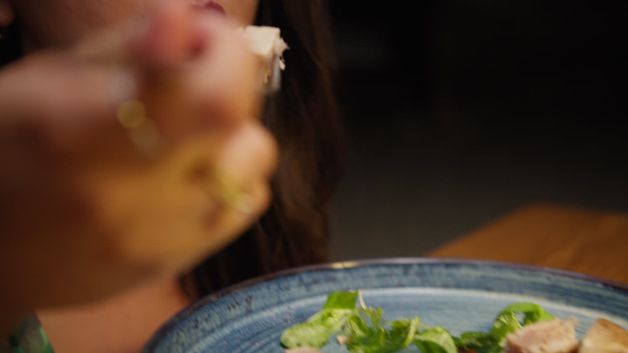 Woman Enjoying The Taste Of Fresh Tuna Dish At The Restaurant For Dinner