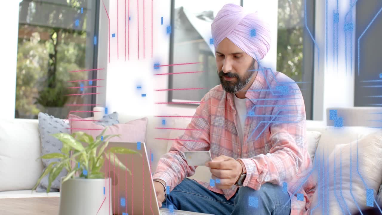 Man sitting on sofa holding card typing on laptop paying financial UI overlays building then fading