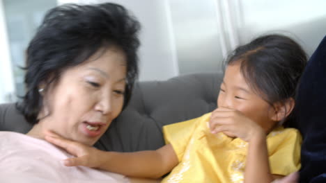 Slow-Motion-Shot-Of-Grandmother-And-Granddaughters-Laughing