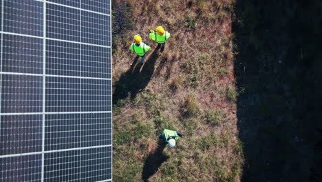 Drone-of-solar-panels,-engineering-people