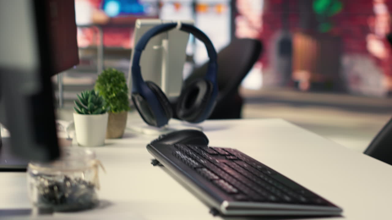 Office desktop setup includes monitors displaying terminal interfaces