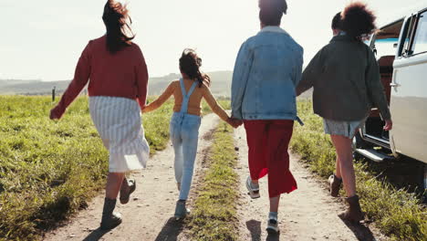 happy, skipping and family holding hands outdoor