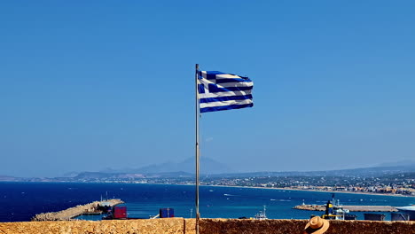 greek flag at the venetian fortezza or citadel in the city of rethymno on the island of crete, greece