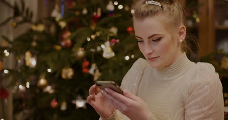 Woman-Using-Tablet-Pc-At-Home-During-Christmas