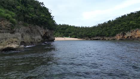 Stunning-Aerial-View-of-Tropical-Lagoon-with-Rock-Cliffs,-Catanduanes,-Philippines