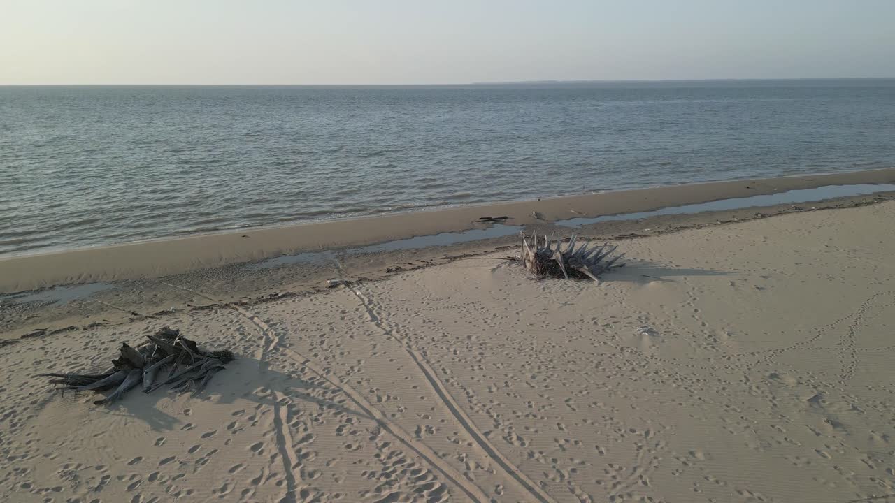 Aerial Drone View During Summer Alit Fishing Village,Kabong With, Facing Open Blue Sea, White Sandy Beach,Green Coconut, Palm Trees,And River,Sarawak,Borneo