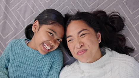 happy, family kiss and smile on carpet lying