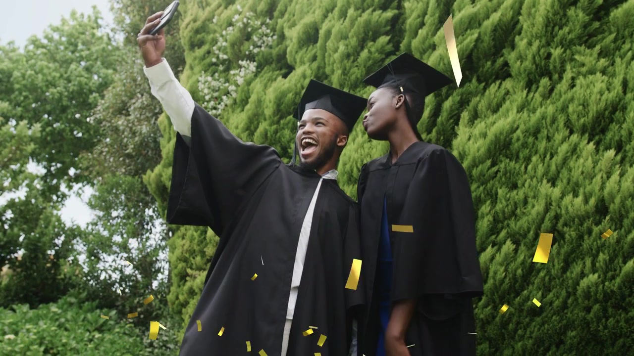 Female and male graduates holding diplomas, reacting to falling confetti and taking phone selfie