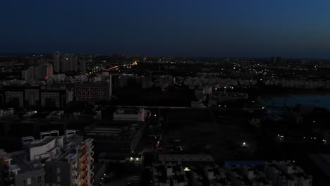 aerial view of chennai late evening,india with orange skies. follow shot, pan right