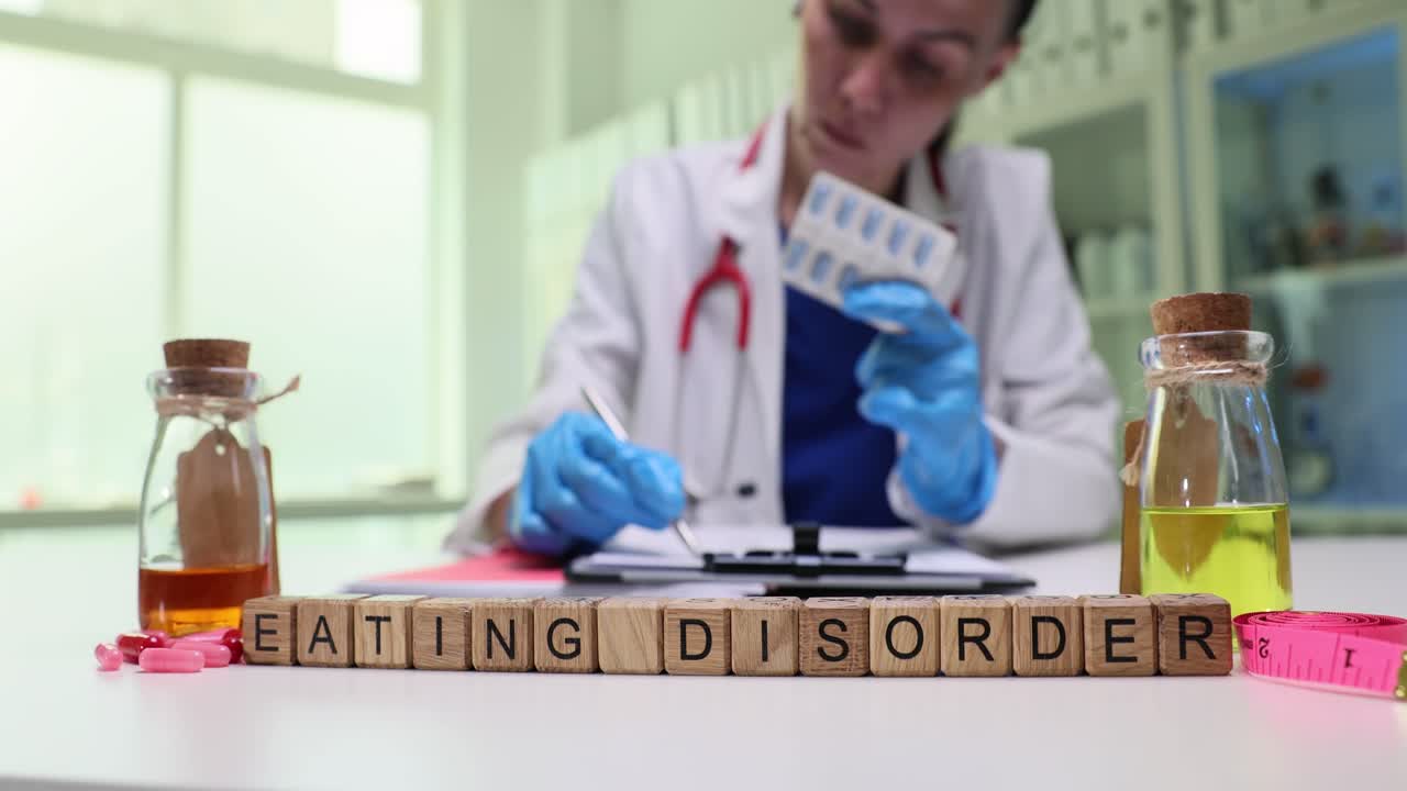 Medical Professional Addressing Eating Disorder with Medication and Supplies