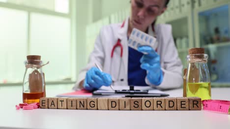medical professional addressing eating disorder with medication and supplies