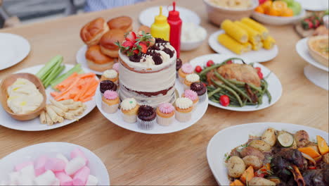 outdoor party table with various foods