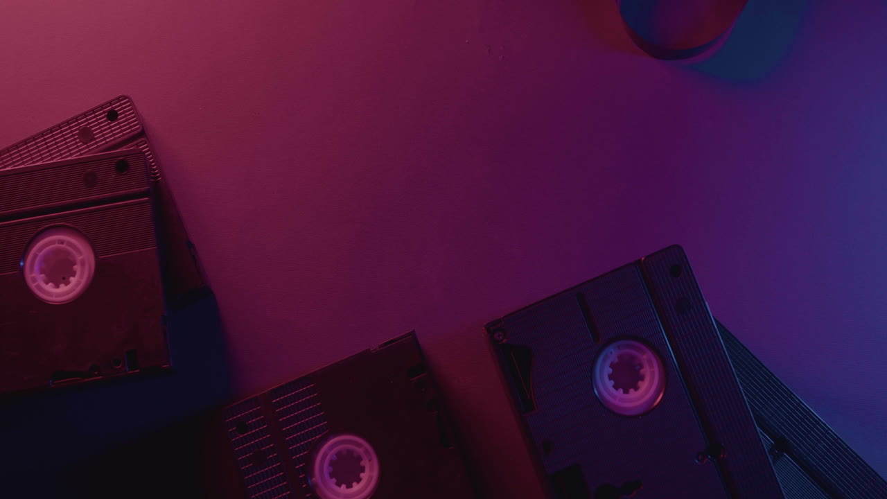 VHS cassette on purple background